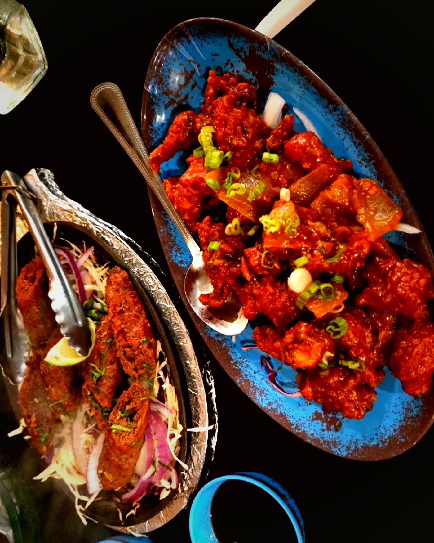 A platter with seekh kebab and chilli chicken