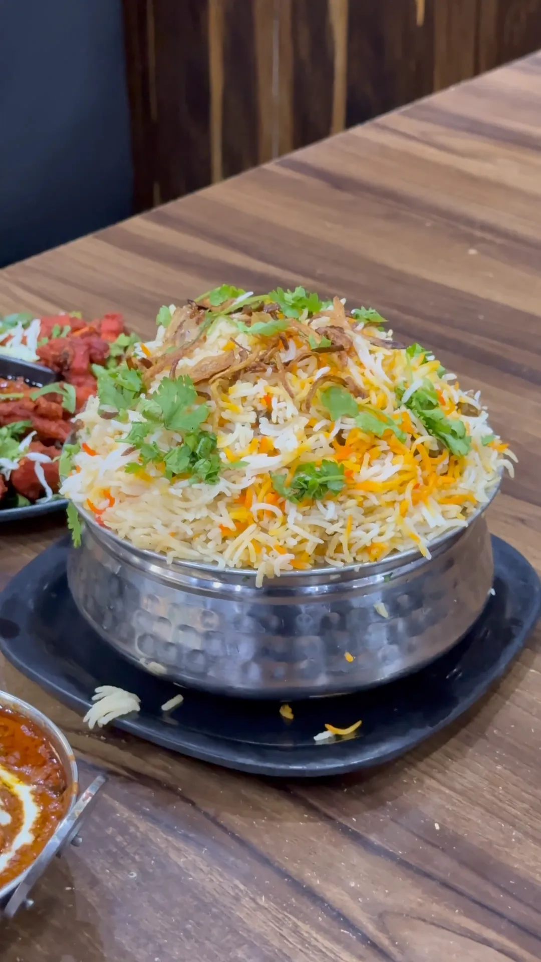 Biryani served in a metal handi